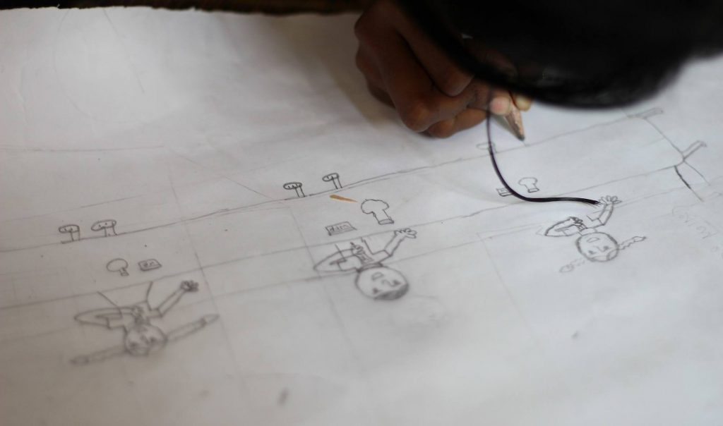A child in Bangladesh drawing a future without hunger.
