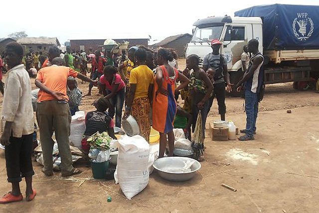 Families receive emergency food assistance at a distribution site in Kaga Bandoro town, Central African Republic.