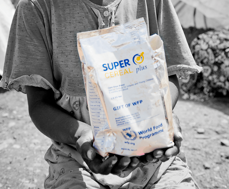 Image of a kids holding cereal