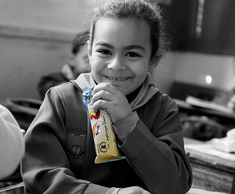 A child eating a snack.