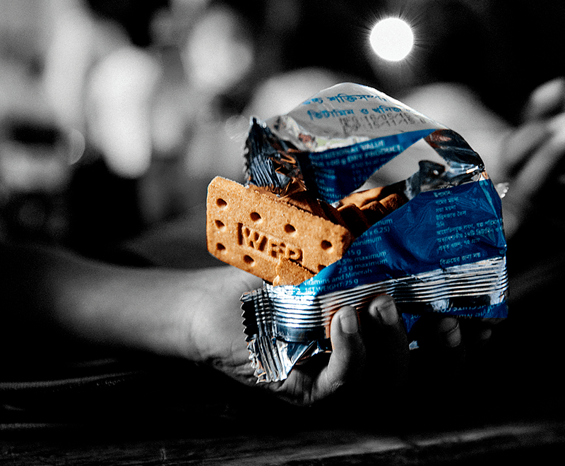 Image of kid hand holding a snack bar