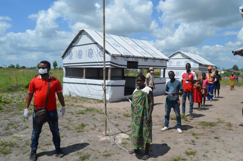 People wait for food in Mozambique