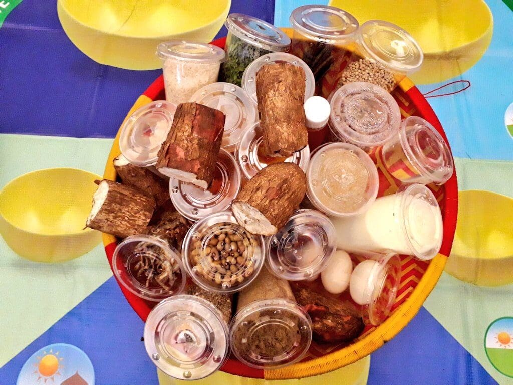 A basket of food samples sits on a colorful table.