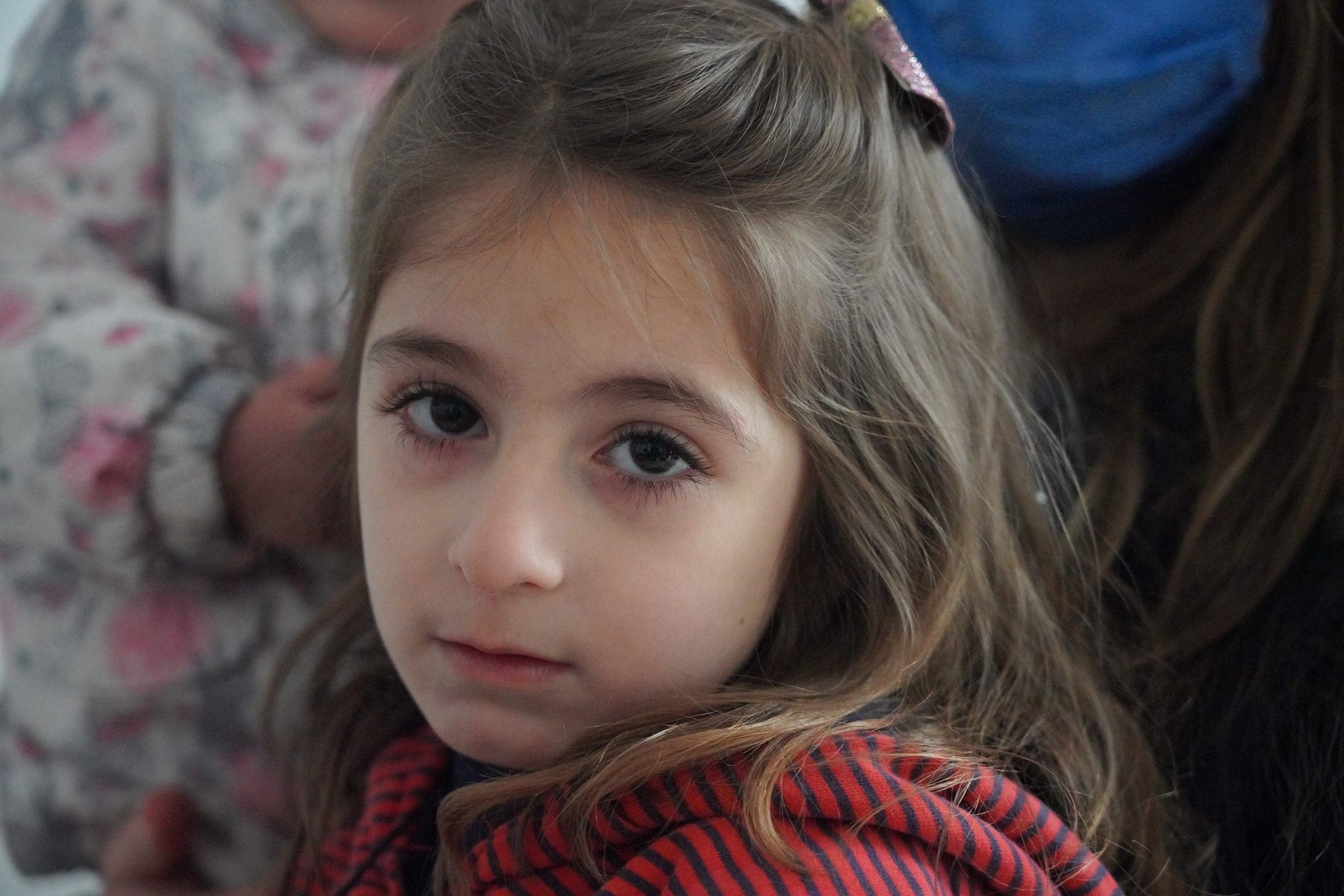 a young girl with a bow in her hair