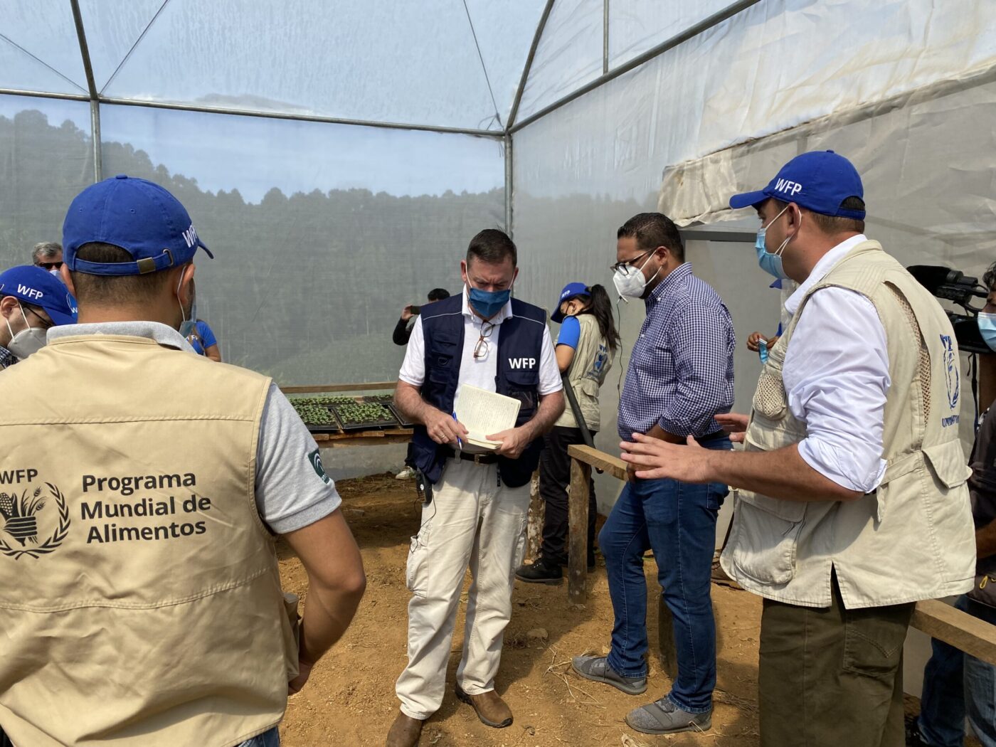 WFP USA president Barron Segar talks with other WFP staff in Central America