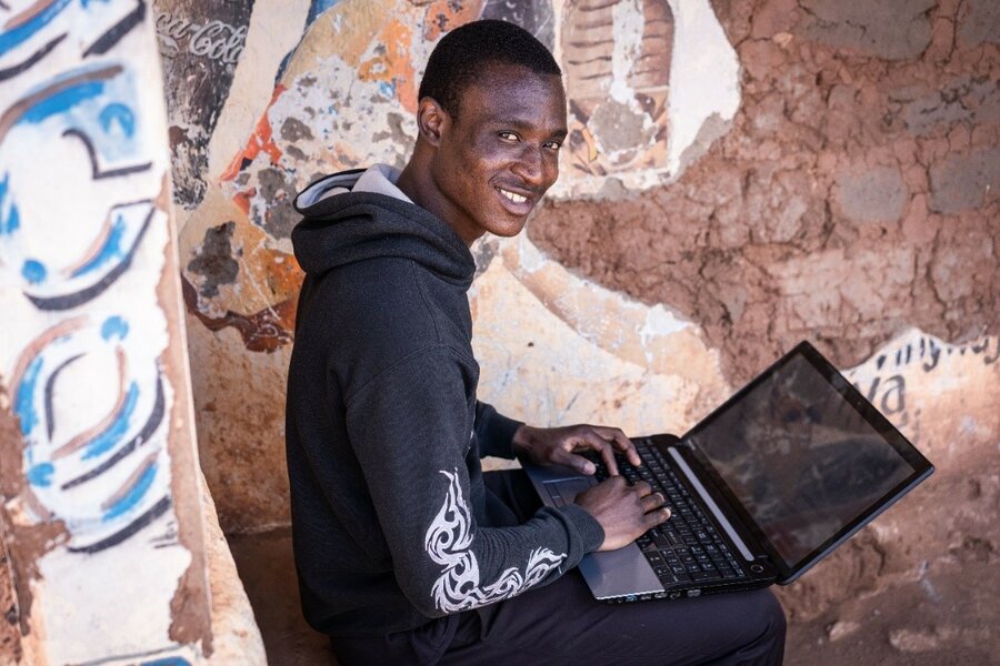 man in black hoodie on computer