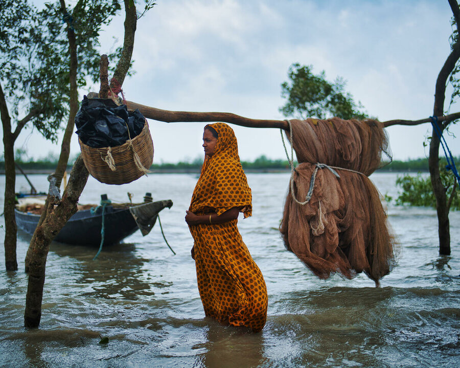 woman standing in flooded waters