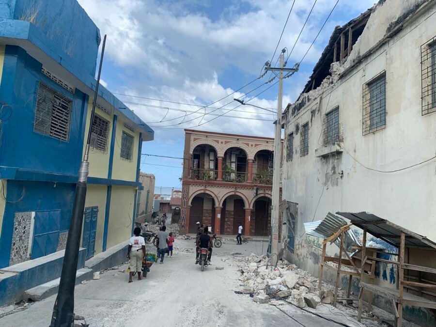 collapsed buildings and rubble in street