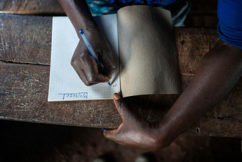 woman writing in notebook