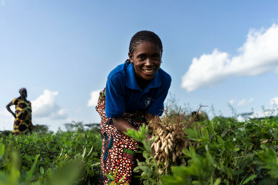 woman holding peanuts in garden