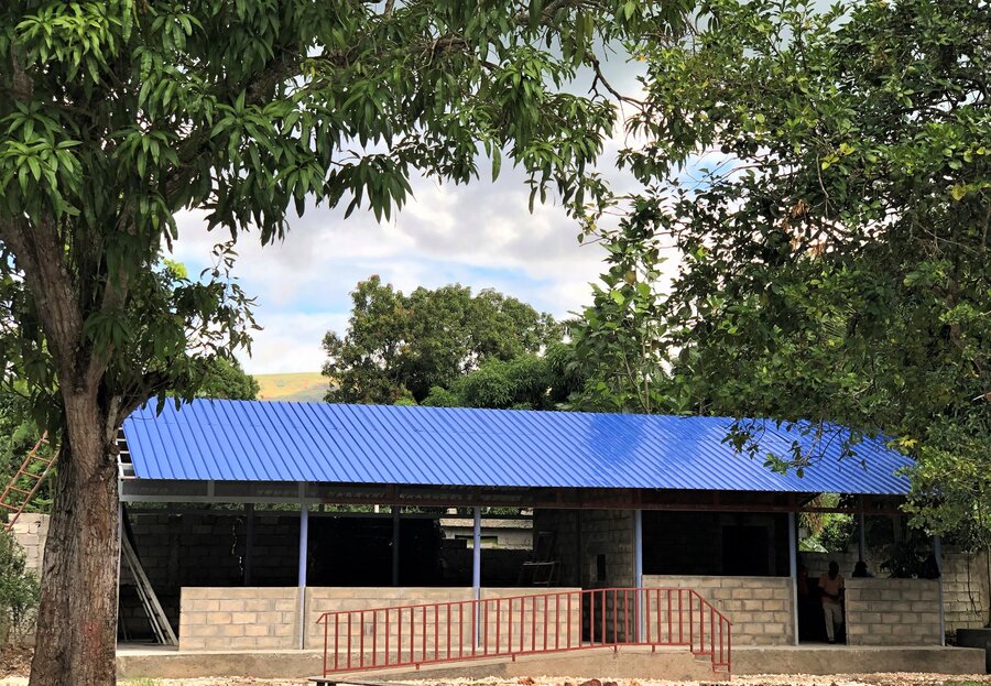 school with open air windows and blue roof