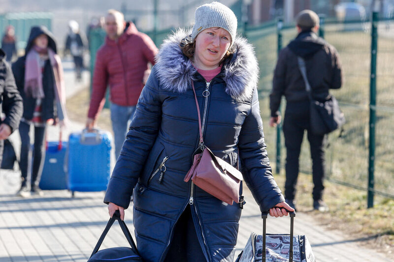 woman carrying suitcases and walking long distance