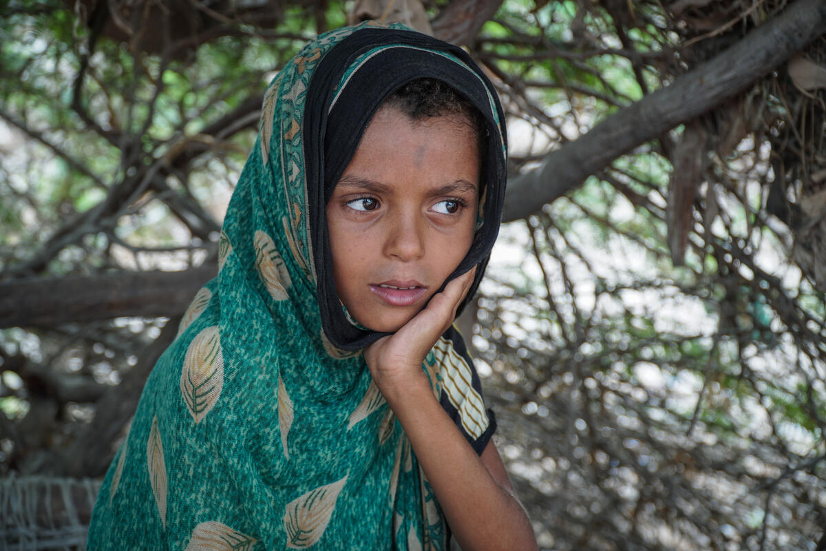 young girl in green headscarf