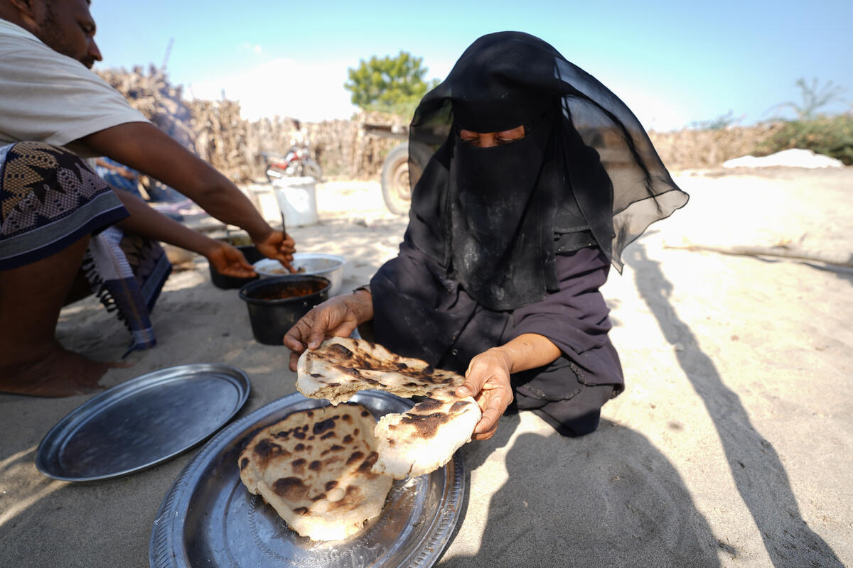 woman holding bread