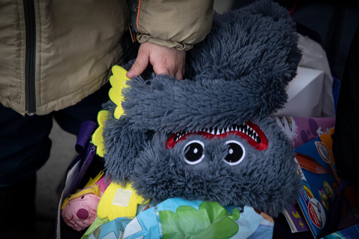 little boy holding toy