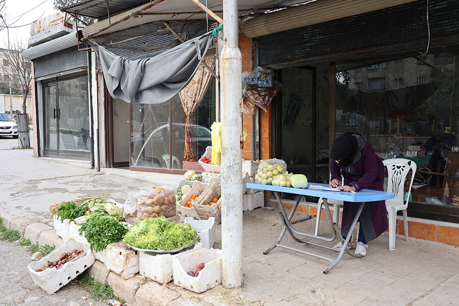 Woman selling vegetables.