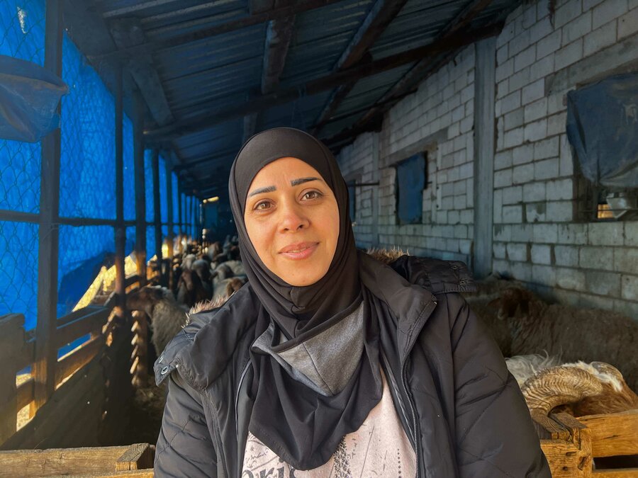 woman in black headscarf in farm