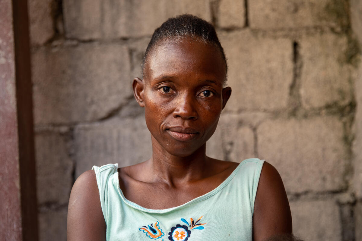 Haitian woman in green shirt