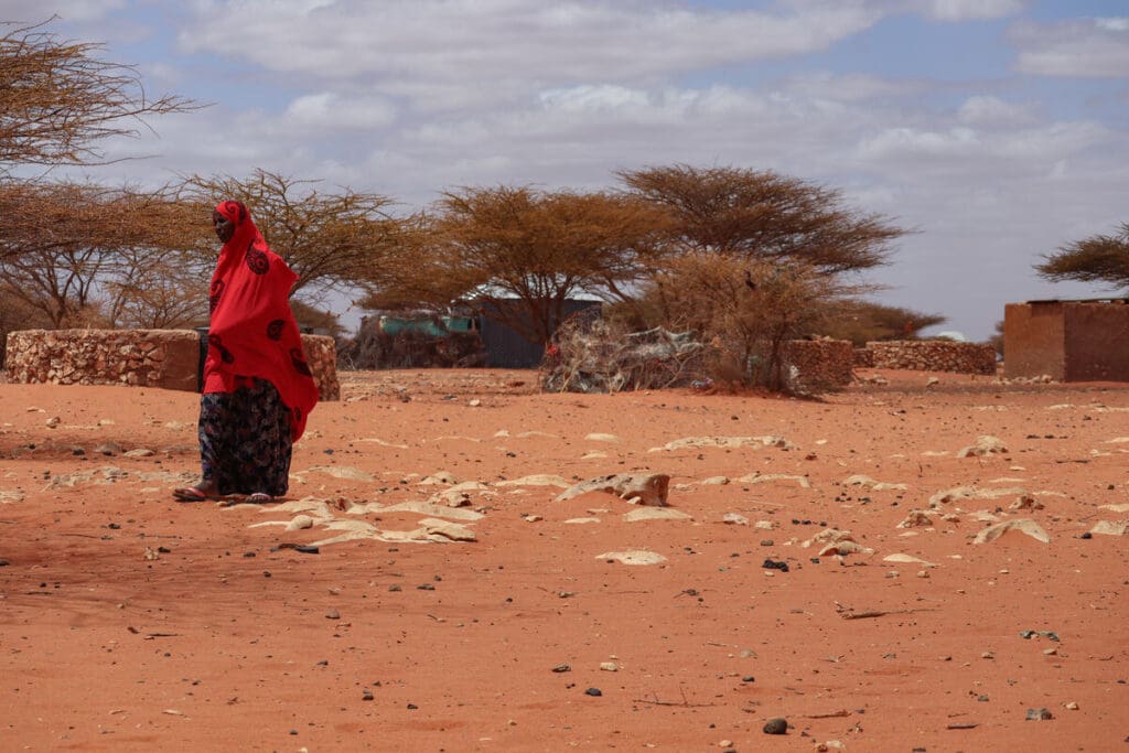 A woman walking outside WFP outlet in Somalia