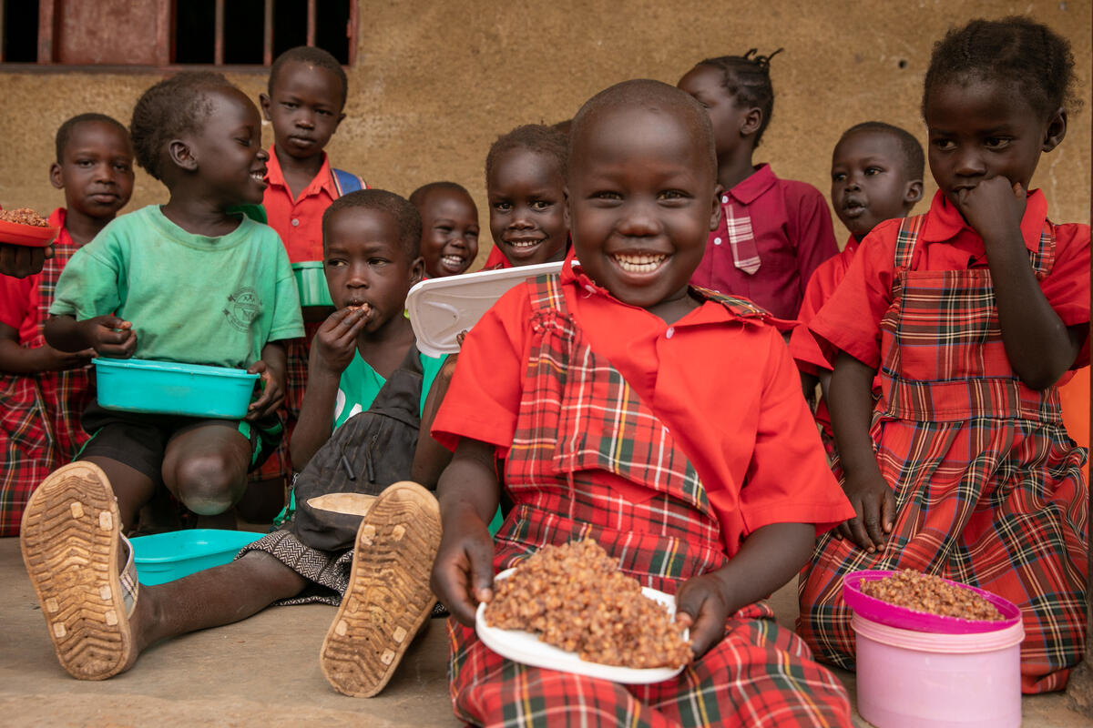 Child in South Sudan eats a school lunch