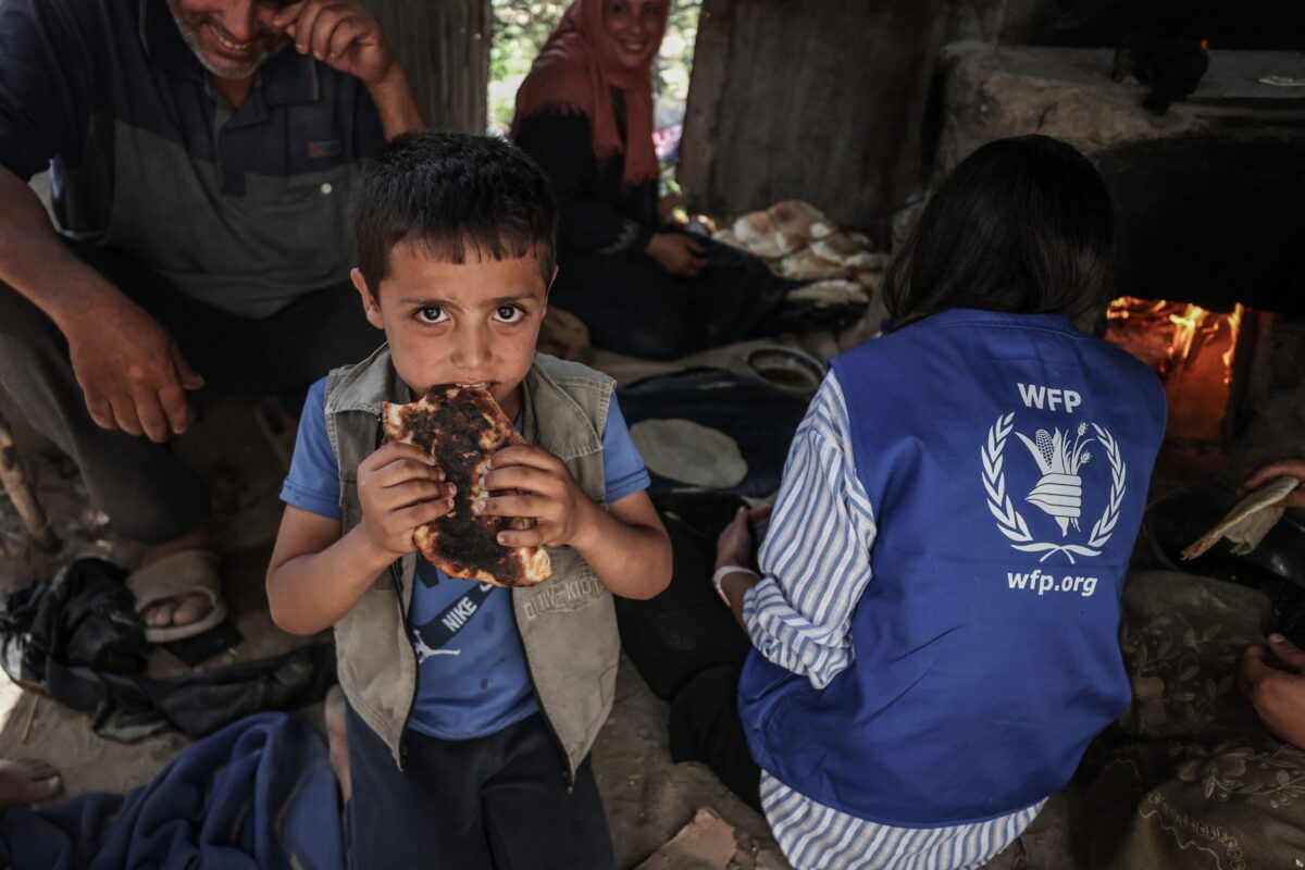 Boy eats bread from WFP in Gaza